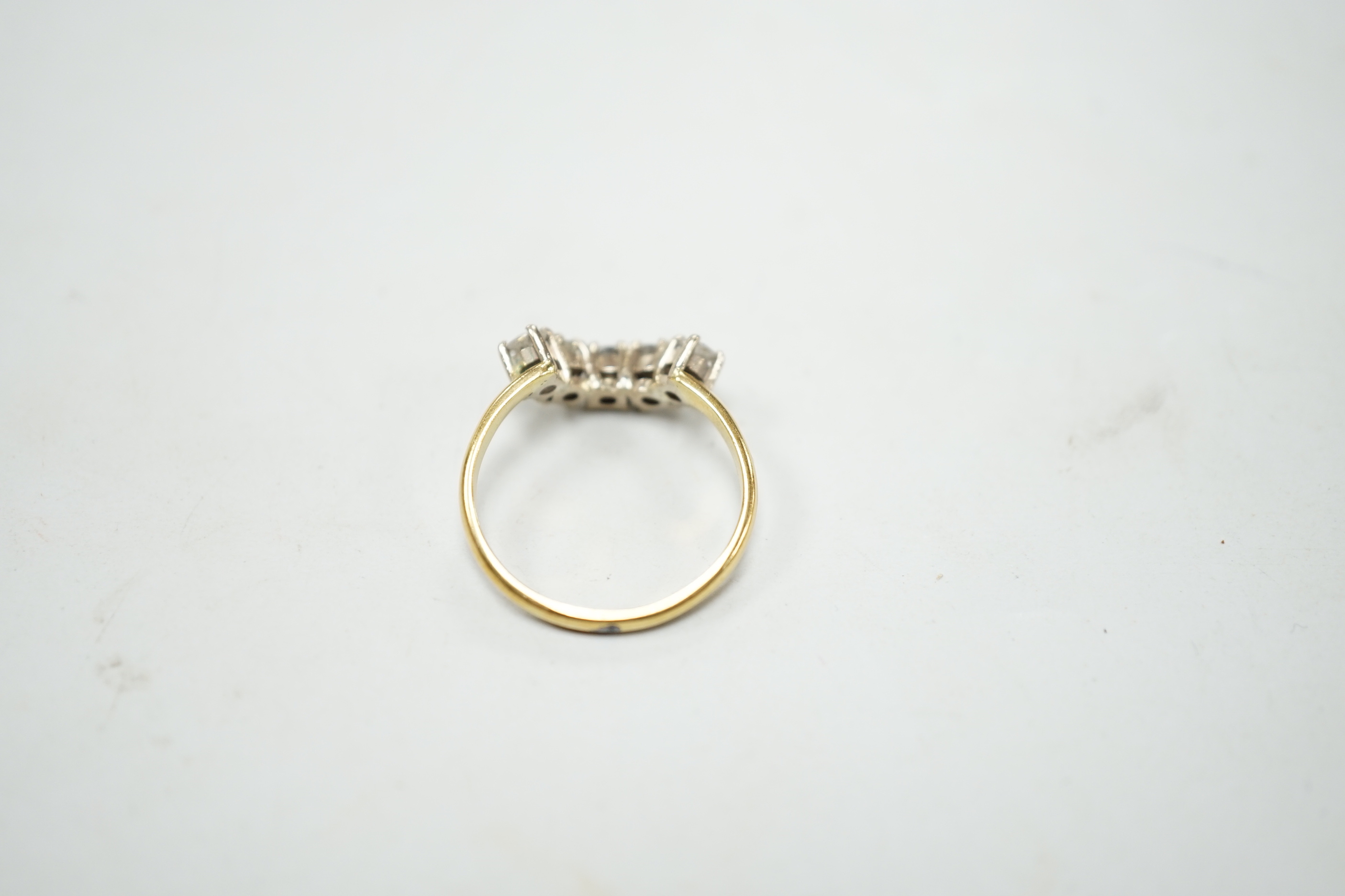 A modern 18ct gold and five stone diamond set demi-lune ring (part of a wedding set?) size M, gross 2.9 grams.
